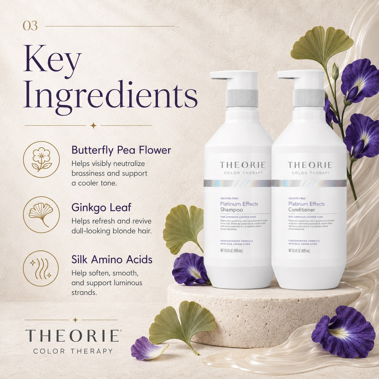 Theorie Color Therapy shampoo and conditioner bottles with butterfly pea flowers and ginkgo leaves on a decorative background.
